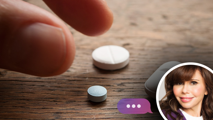 ask heidi folic acid and male fertility, hand about to grab a pill