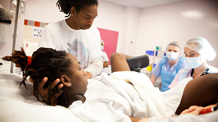 woman in back labor pain