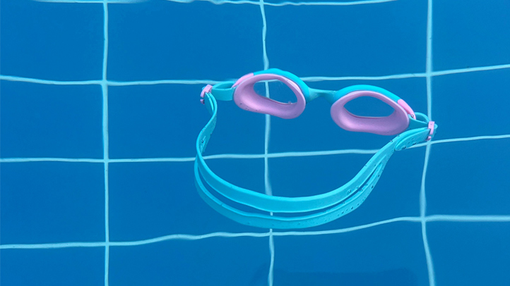 kid's goggles floating in pool