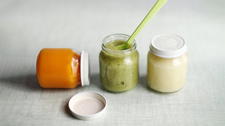 three jars of baby food in a row