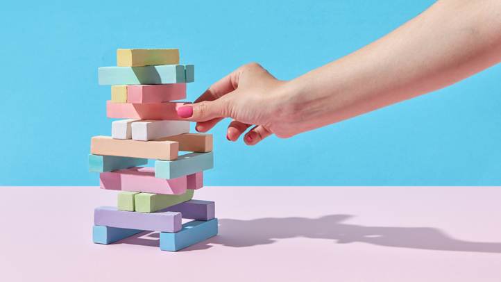 Mom playing Jenga with a tower of chalk
