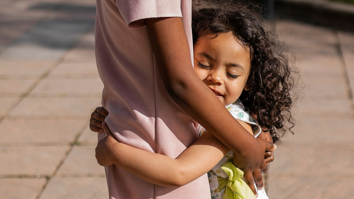 how to teach your toddler empathy, little girl hugging older child