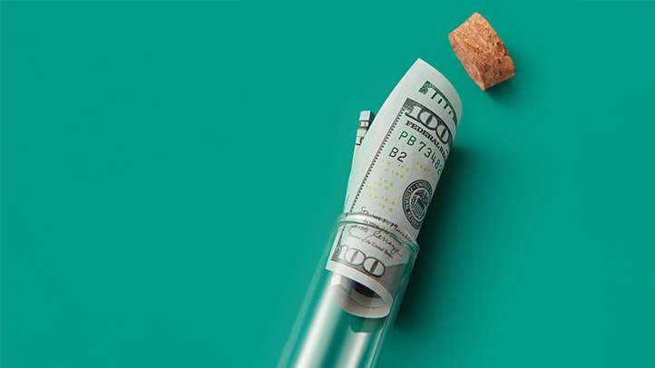 money in a glass bottle