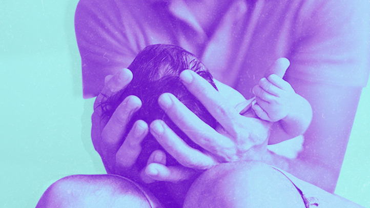 dad holding newborn baby