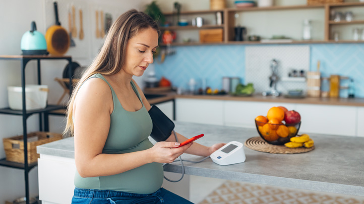 woman checking blood pressure