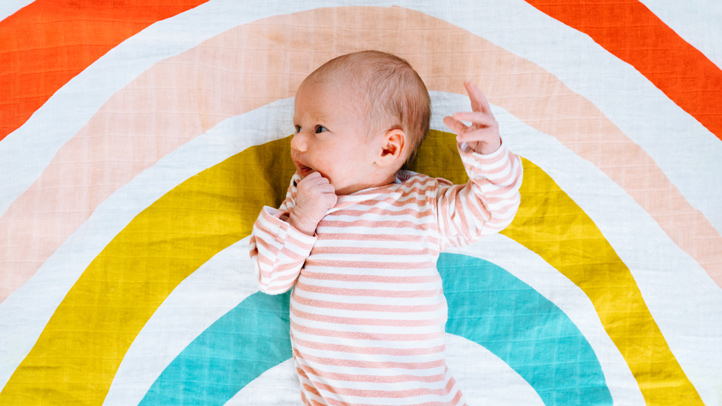 rainbow baby, newborn baby on rainbow blanket