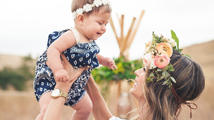 mom and baby with flowers in hair, spring baby names